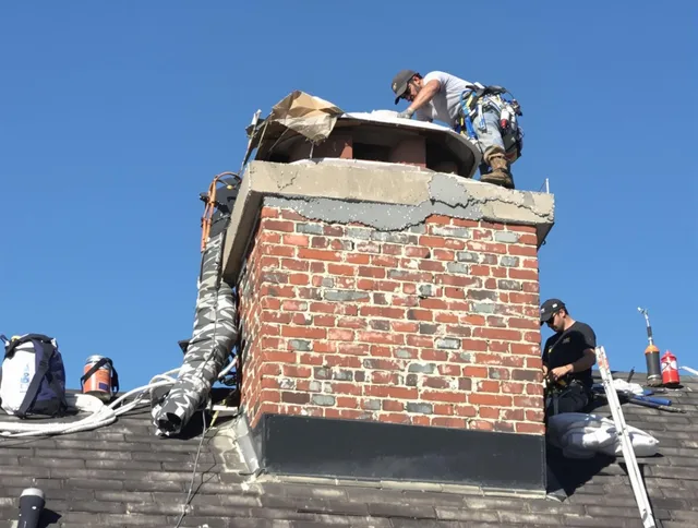 Wolcott Chimney Sweep installing a custom chimney crown in Wolcott, CT