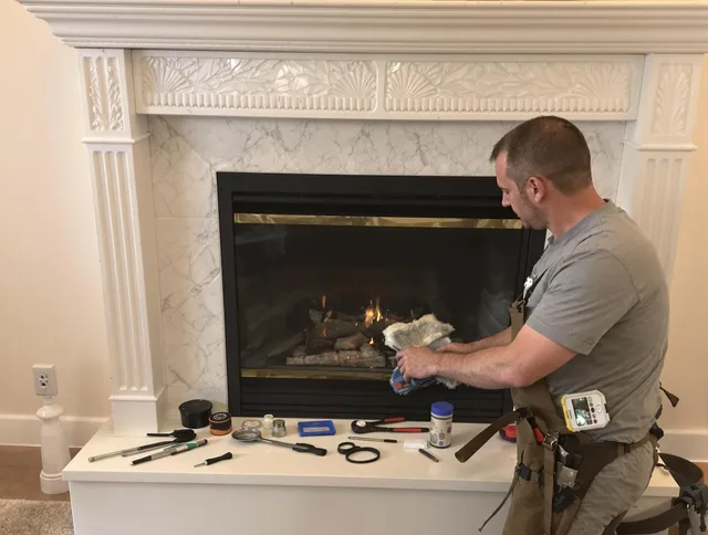 Wolcott Chimney Sweep performing fireplace maintenance in Wolcott, CT