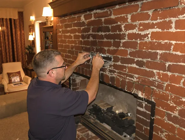Wolcott Chimney Sweep expert fixing a fireplace in Wolcott, CT